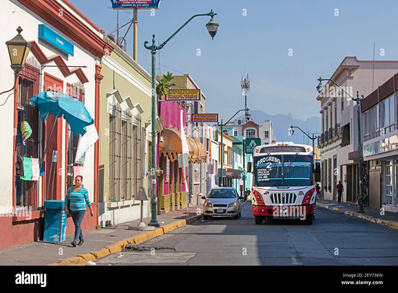 Public transport bus driving the Progreso 2 route through colourful street in the city Tepic, Nayarit, Mexico Stock Photo