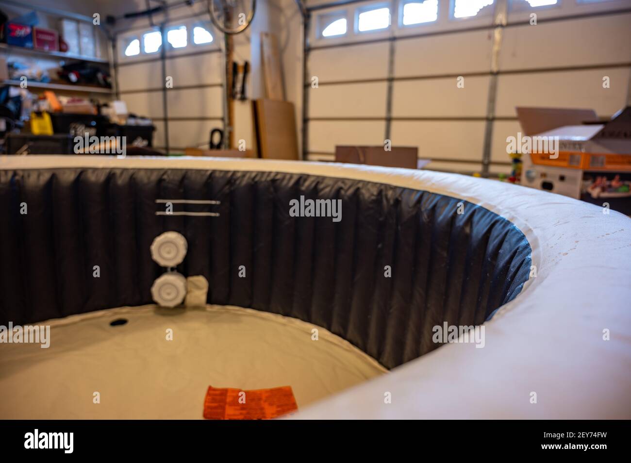 redneck inflatable indoor hot tub setup inside a garage Stock Photo Alamy