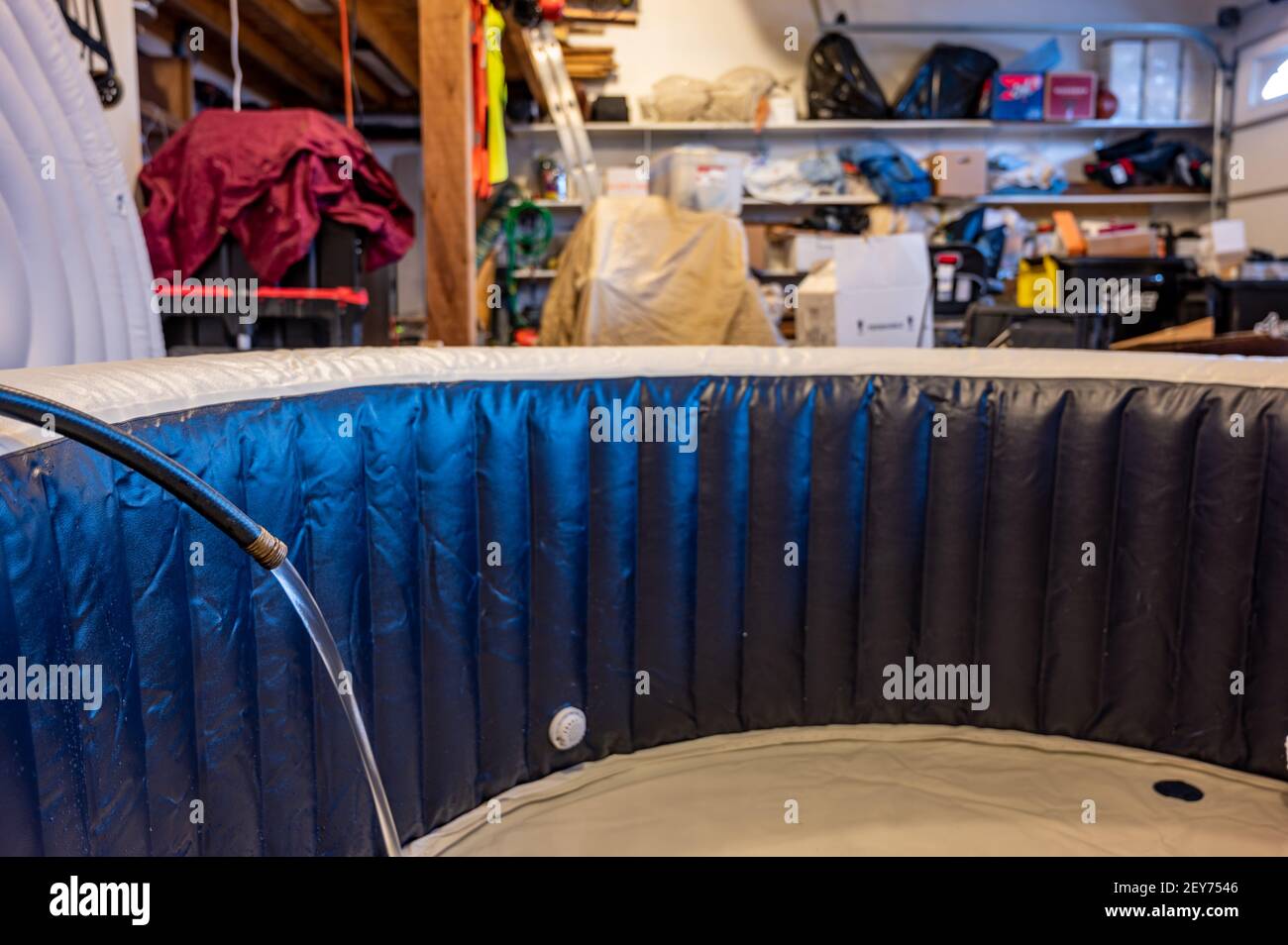 redneck inflatable indoor hot tub setup inside a garage Stock Photo Alamy