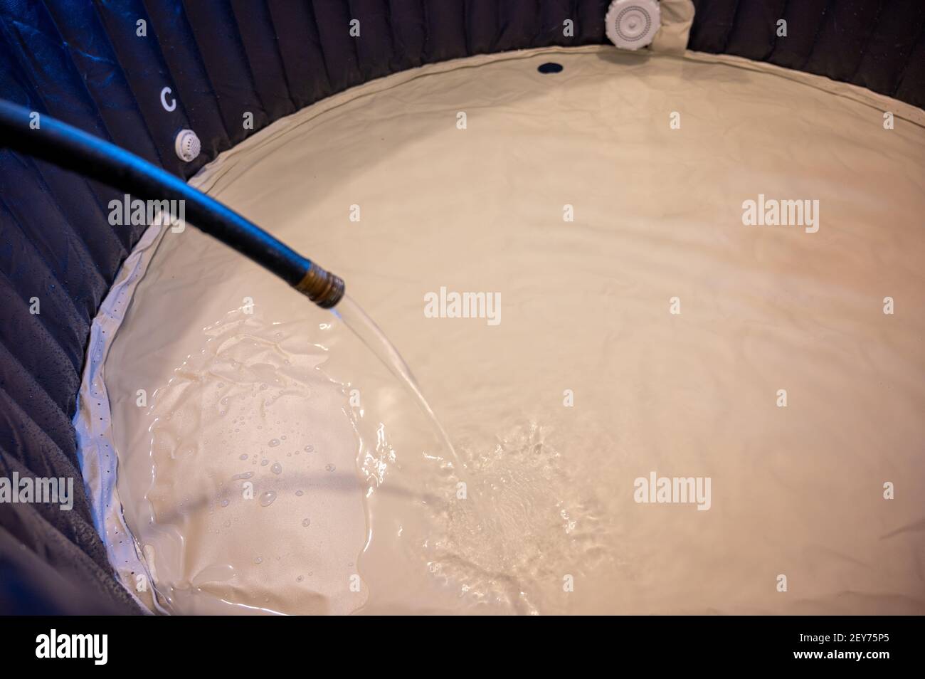 redneck inflatable indoor hot tub setup inside a garage Stock Photo Alamy