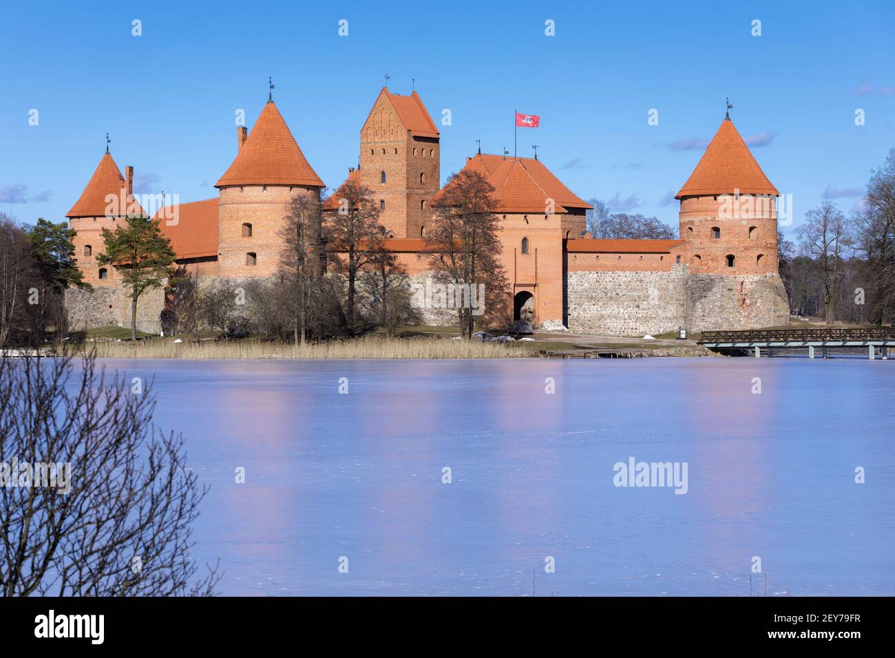 View on Trakai castle across frozen lake. Trakai is a historic city and  lake resort in Lithuania. It lies 28 kilometres (17 miles) west of Vilnius,  th Stock Photo - Alamy