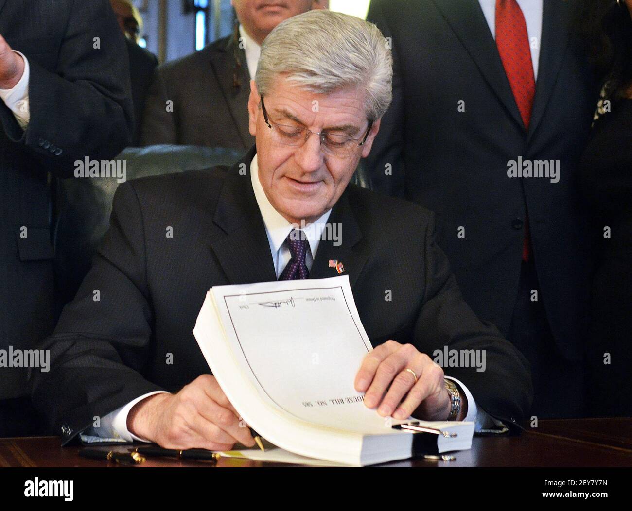 March 31, 2014; Jackson , MS, USA; Gov. Phil Bryant makes House Bill 585 official Monday during a signing ceremony at the state Capitol in Jackson. The bipartisan criminal justice reform package is designed to protect public safety, clarify sentencing practices and control corrections costs. Mandatory Credit: Greg Jenson/The Clarion-Ledger via USA TODAY NETWORK/Sipa USA Stock Photo