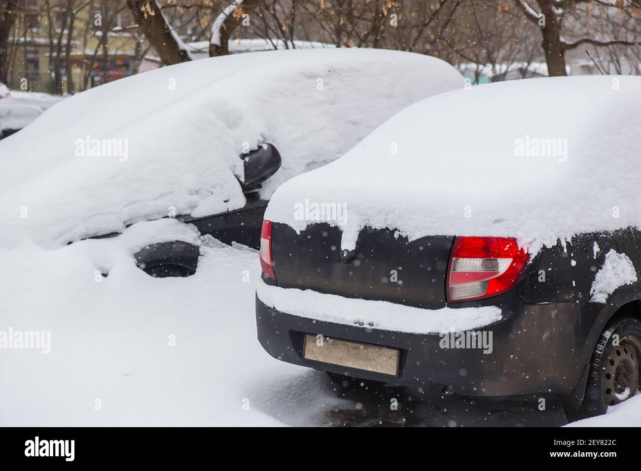 cars in the Parking lot in the winter under the snow Stock Photo - Alamy