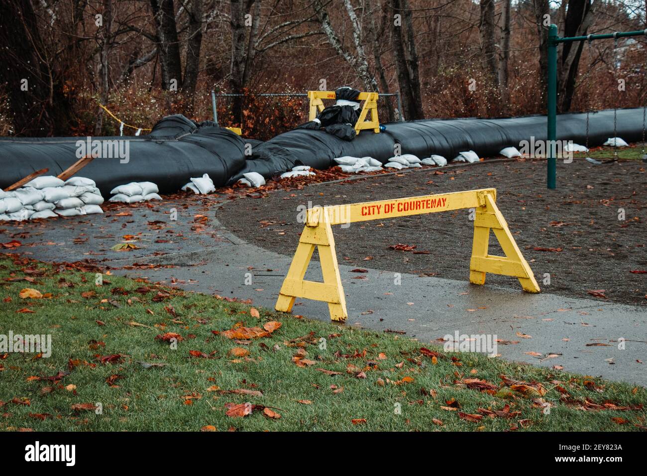 Courtenay, Canada - November 17,2020: View of yellow barrier with aqua dam in the background in Rotary Water Park Stock Photo
