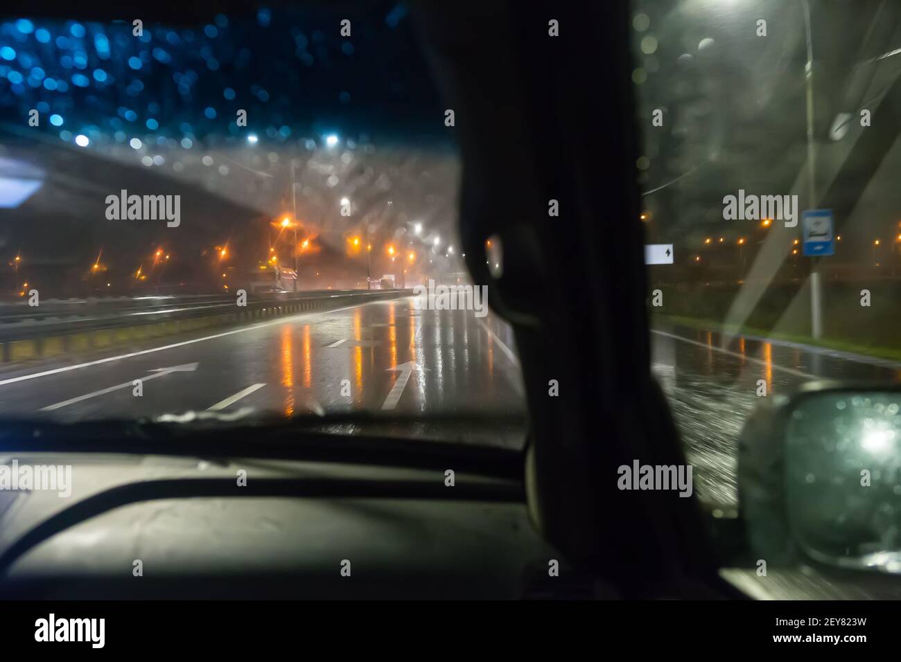 view from a driving car on a wet night highway Stock Photo Alamy