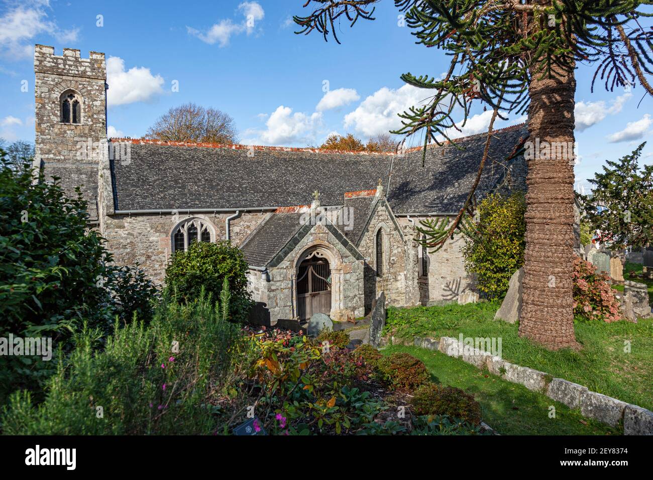 The side roofed porch to the Parish coastal Church of St Mylor near Falmouth and Penryn in Cornwall, UK Stock Photo