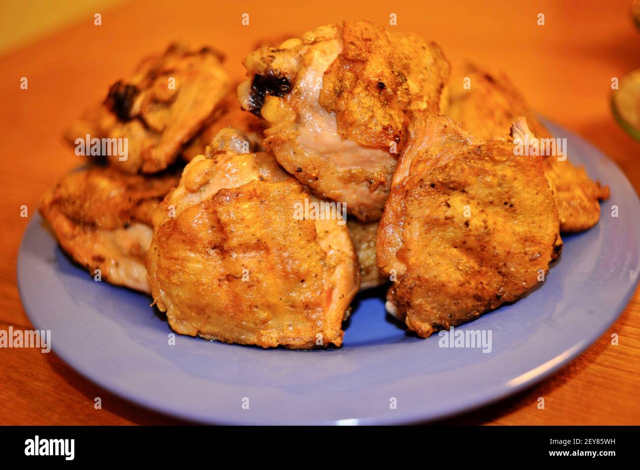 A plated of delicious freshly grilled, golden-brown, cooked marinaded chicken on an outdoor barbecue gas grill, California, USA Stock Photo
