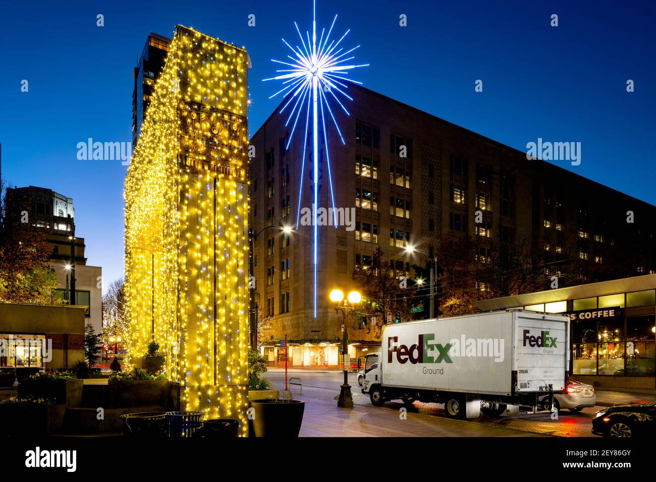 WA17993-00.....WASHINGTON - Christmas decorations in Seattle's West Lake Park with the Seattle Star on the Macy Building. Stock Photo