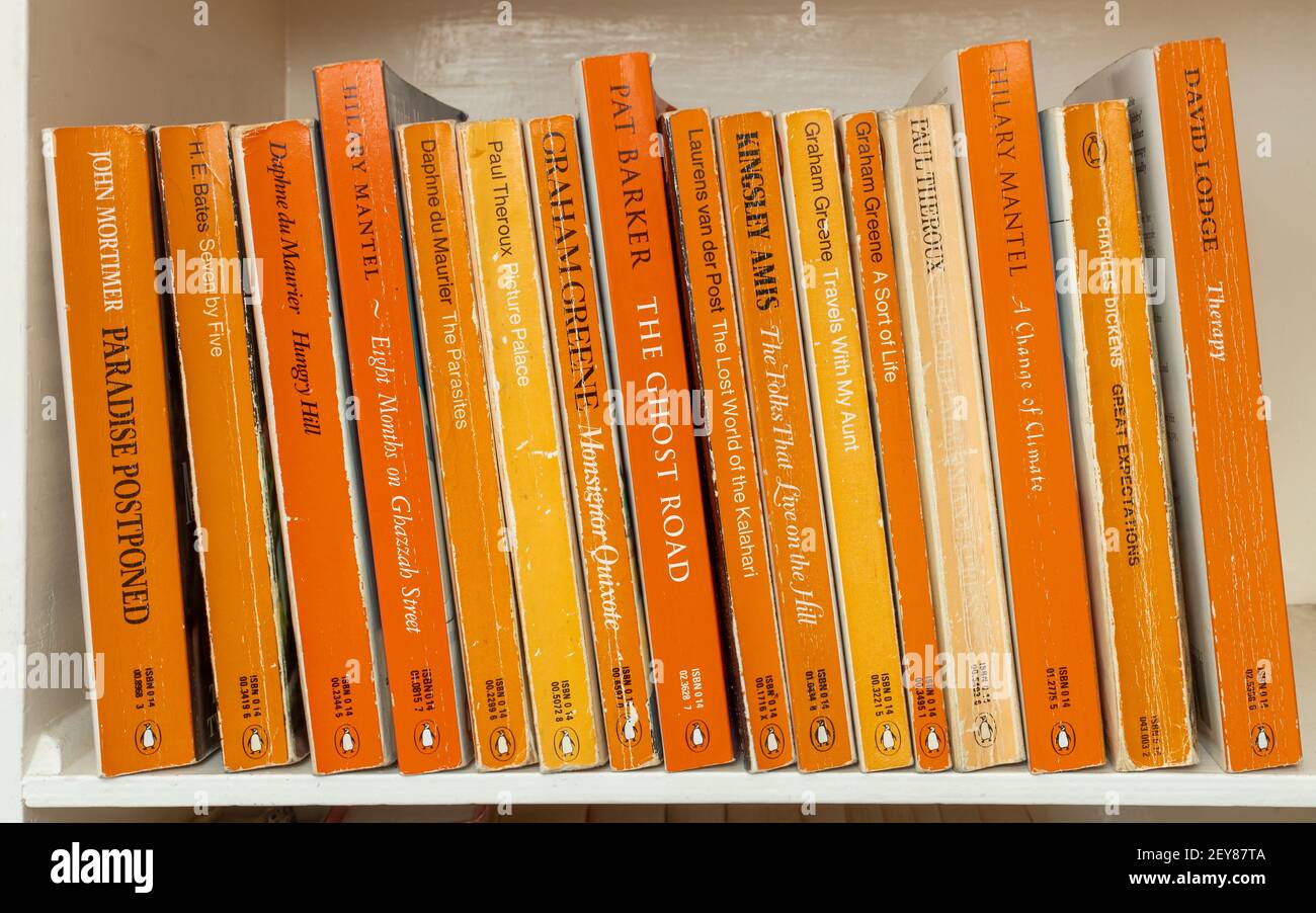 Collection of Penguin paperback books on a bookshelf, UK Stock Photo