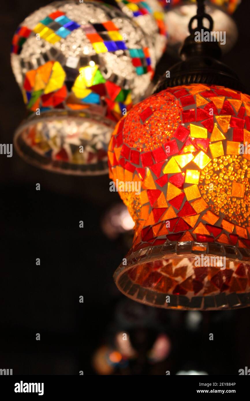 folkloristic colorful glass mosaic lamps in the dark of a Sarajevo market Stock Photo