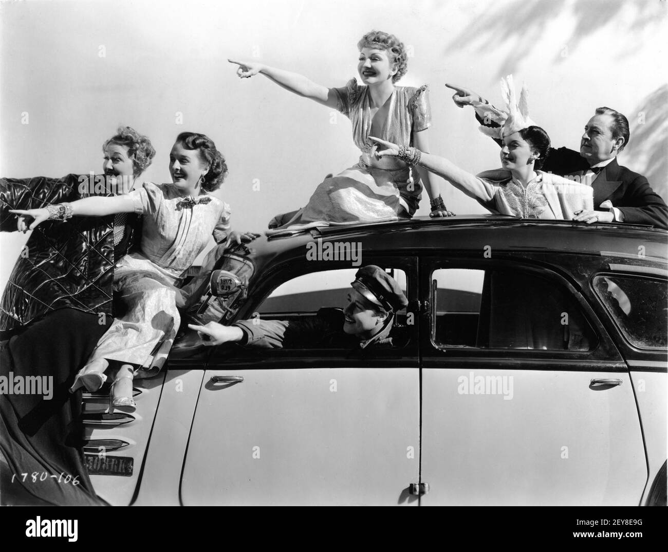 HEDDA HOPPER MARY ASTOR CLAUDETTE COLBERT DON AMECHE ELAINE BARRIE and JOHN BARRYMORE Posed Group Publicity Portrait for MIDNIGHT 1939 director MITCHELL LEISEN screenplay Charles Brackett Billy Wilder Miss Colbert's Gowns by Irene Paramount Pictures Stock Photo