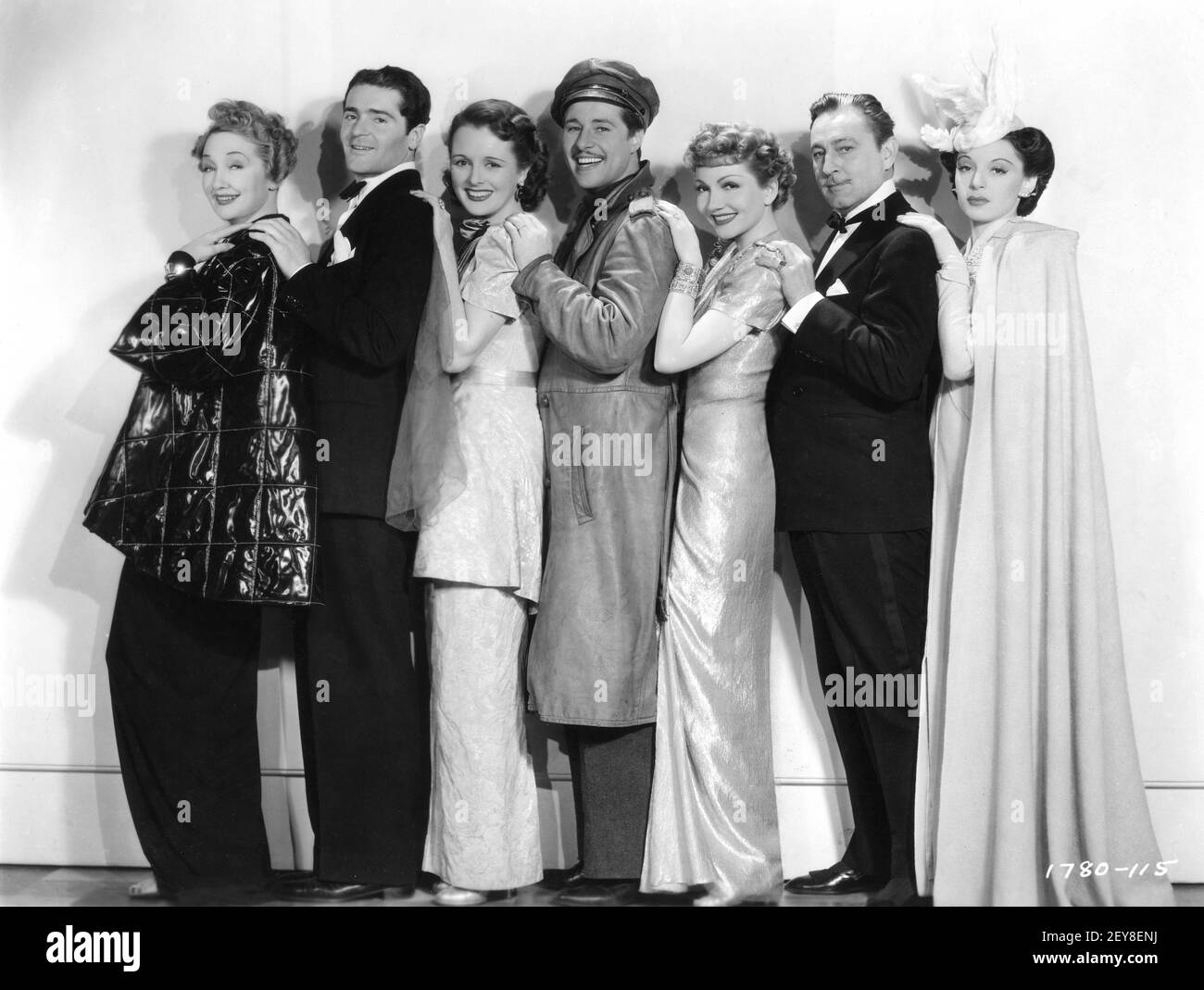 HEDDA HOPPER FRANCIS LEDERER MARY ASTOR DON AMECHE CLAUDETTE COLBERT JOHN BARRYMORE and ELAINE BARRIE Posed Group Publicity Portrait for MIDNIGHT 1939 director MITCHELL LEISEN screenplay Charles Brackett Billy Wilder Miss Colbert's Gowns by Irene Paramount Pictures Stock Photo