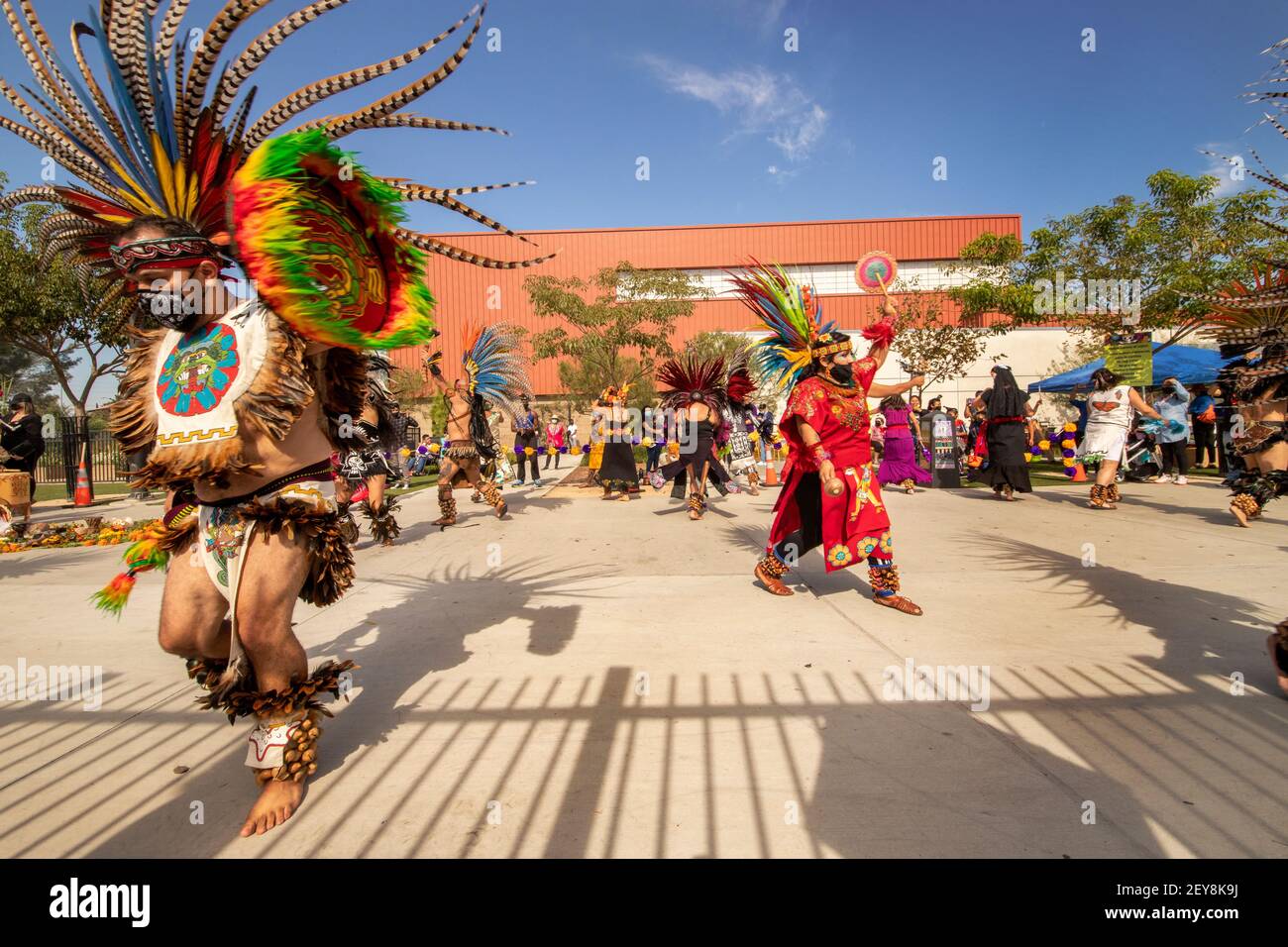 Costumed Hispanic dancers participate in Day of the Dead ceremonies in Santa Ana, CA. Note face masks due to coronavirus pandemic.  The Day of the Dea Stock Photo