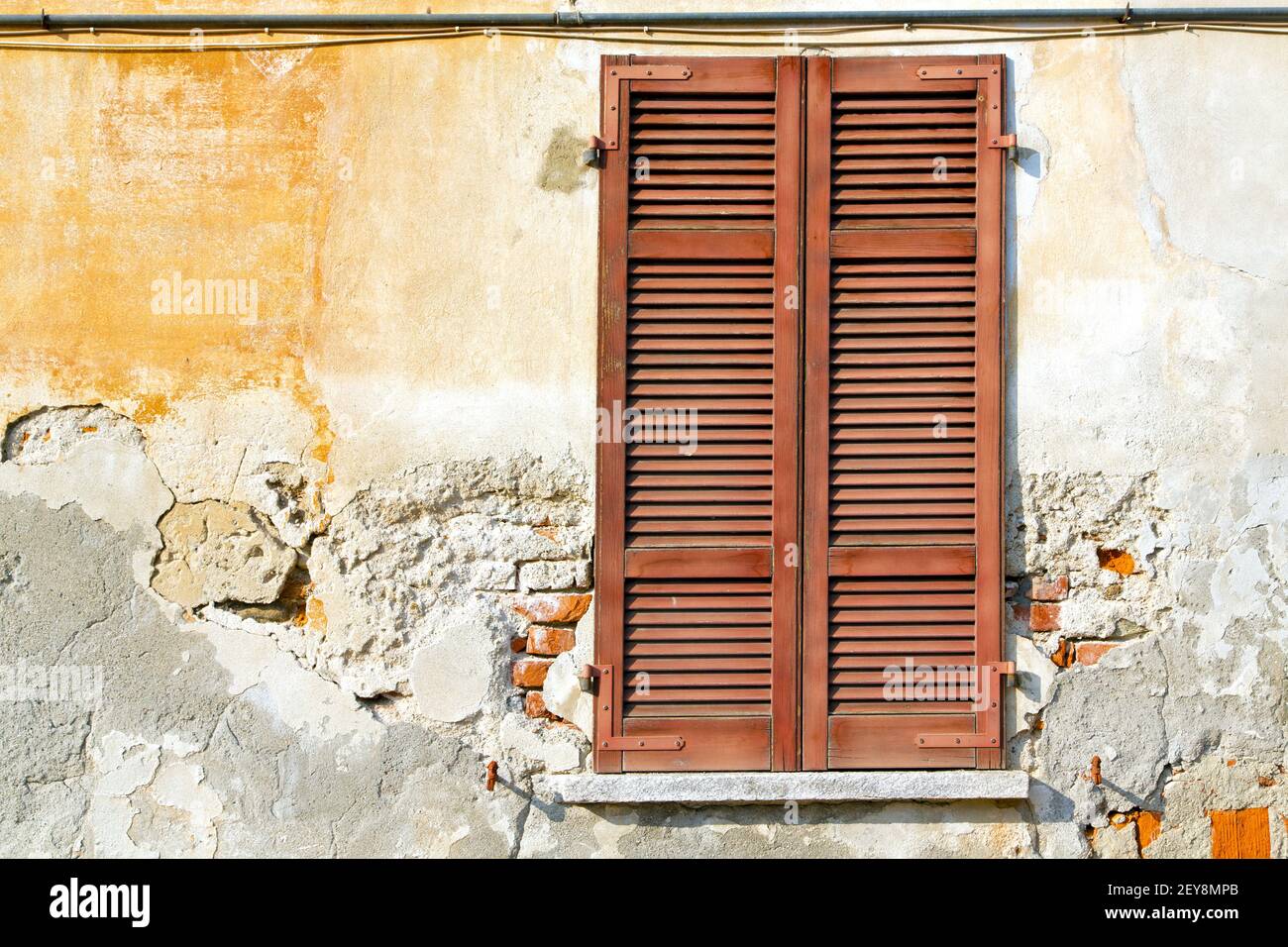 Varano borghi palaces italy     wood venetian blind in the concrete  brick Stock Photo