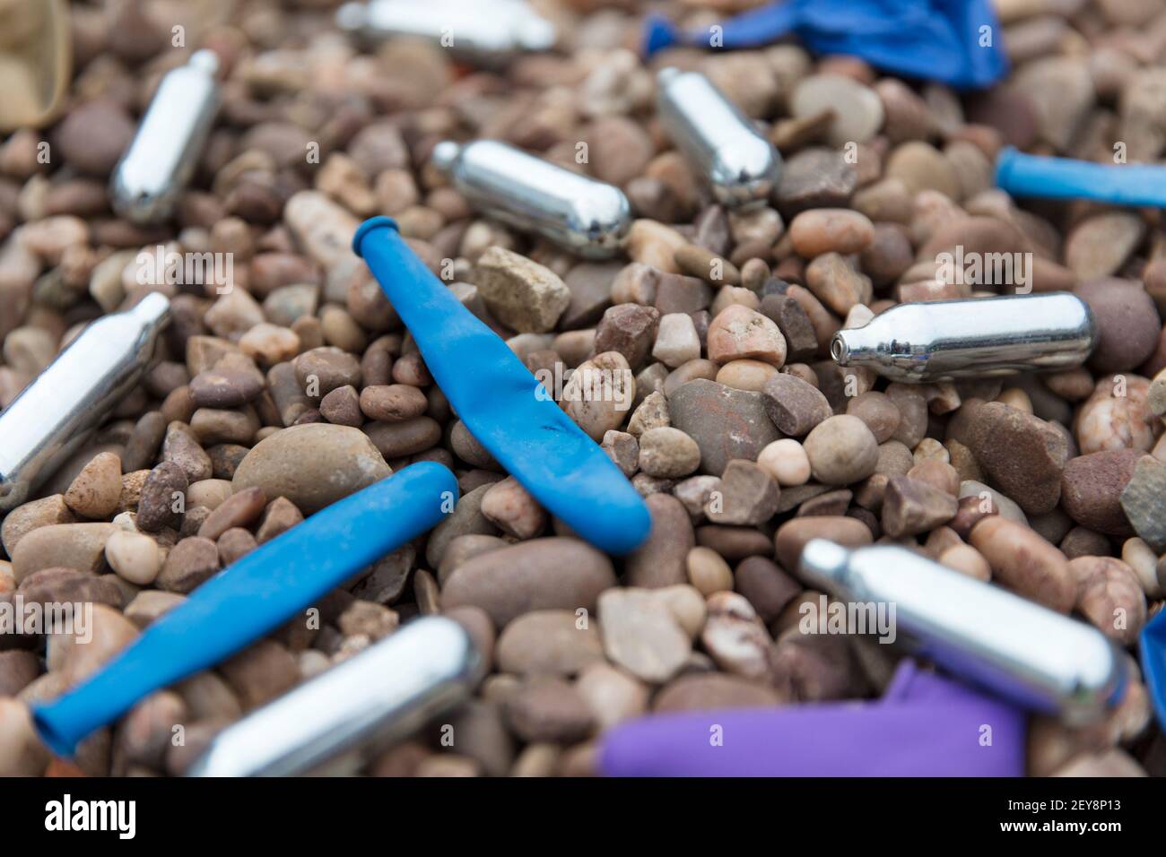 Nitrous oxide metal bulbs or laughing gas recreational drug use Stock