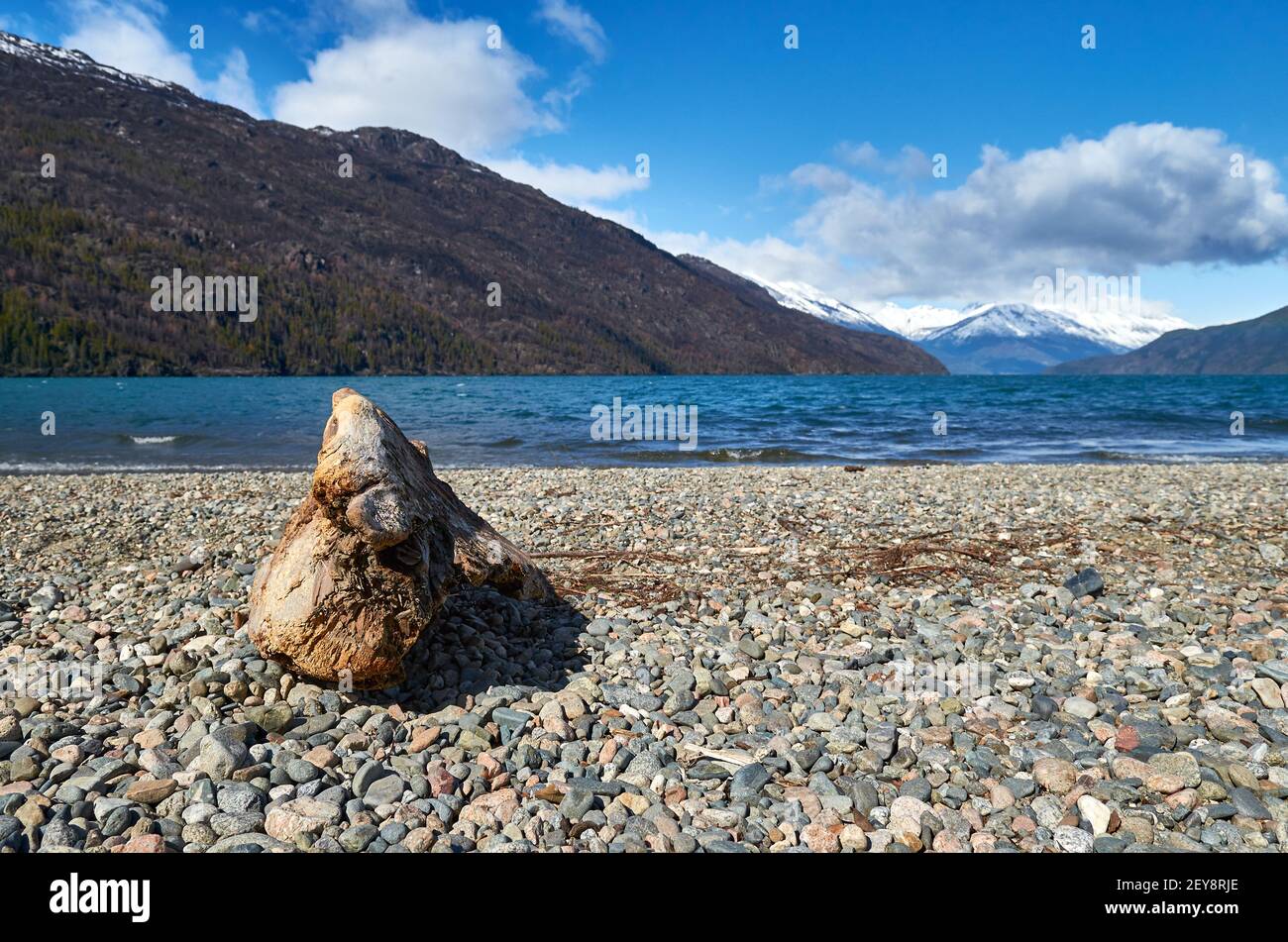 View of the Puelo lake in Chubut, patagonia Argentina, on spring day. Beautiful landscape with snowy mountains and clouds on the blue sky. Stock Photo
