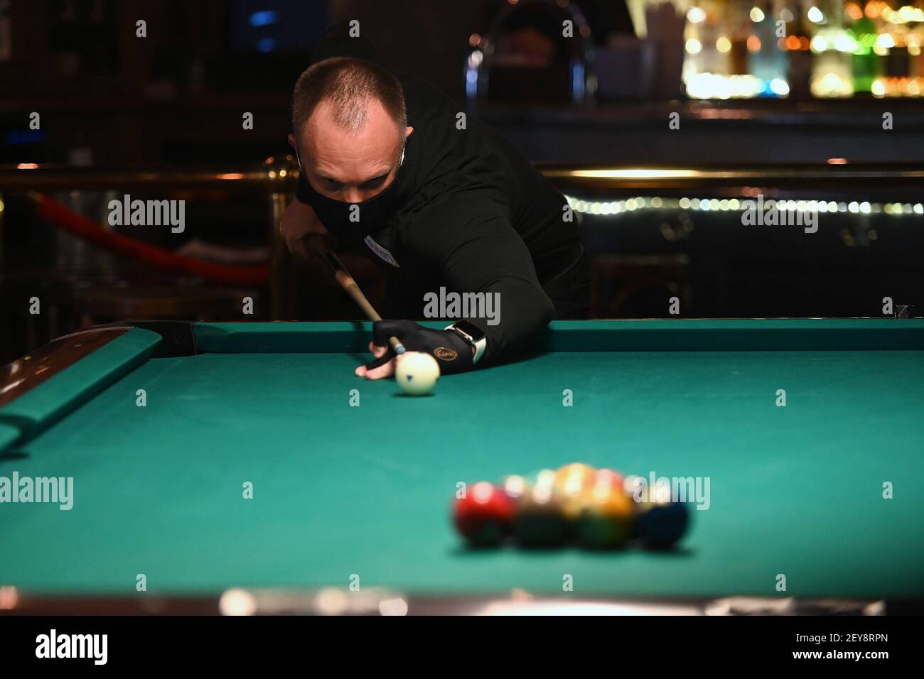 New York, USA. 05th Mar, 2021. Professional pool player Throsten Hohmann  prepares to break during an online charity tournament to raise money for  cancer stricken professional pool player Jeanette Lee at Amsterdam