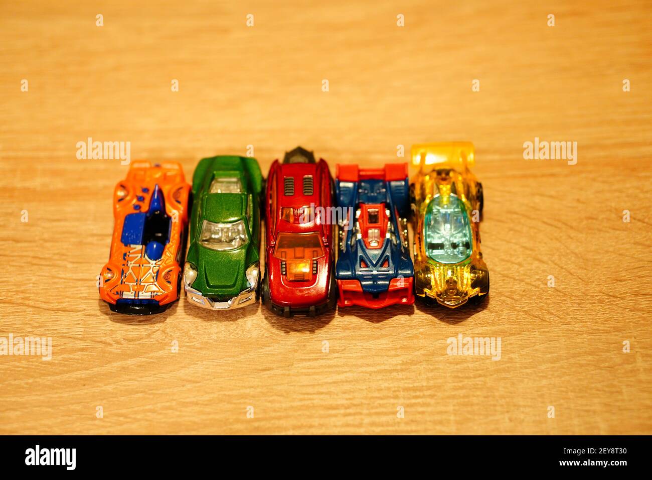 POZNAN, POLAND - Jan 28, 2021: Mattel Hot Wheels race toy model cars on a wooden  table in soft focus Stock Photo - Alamy