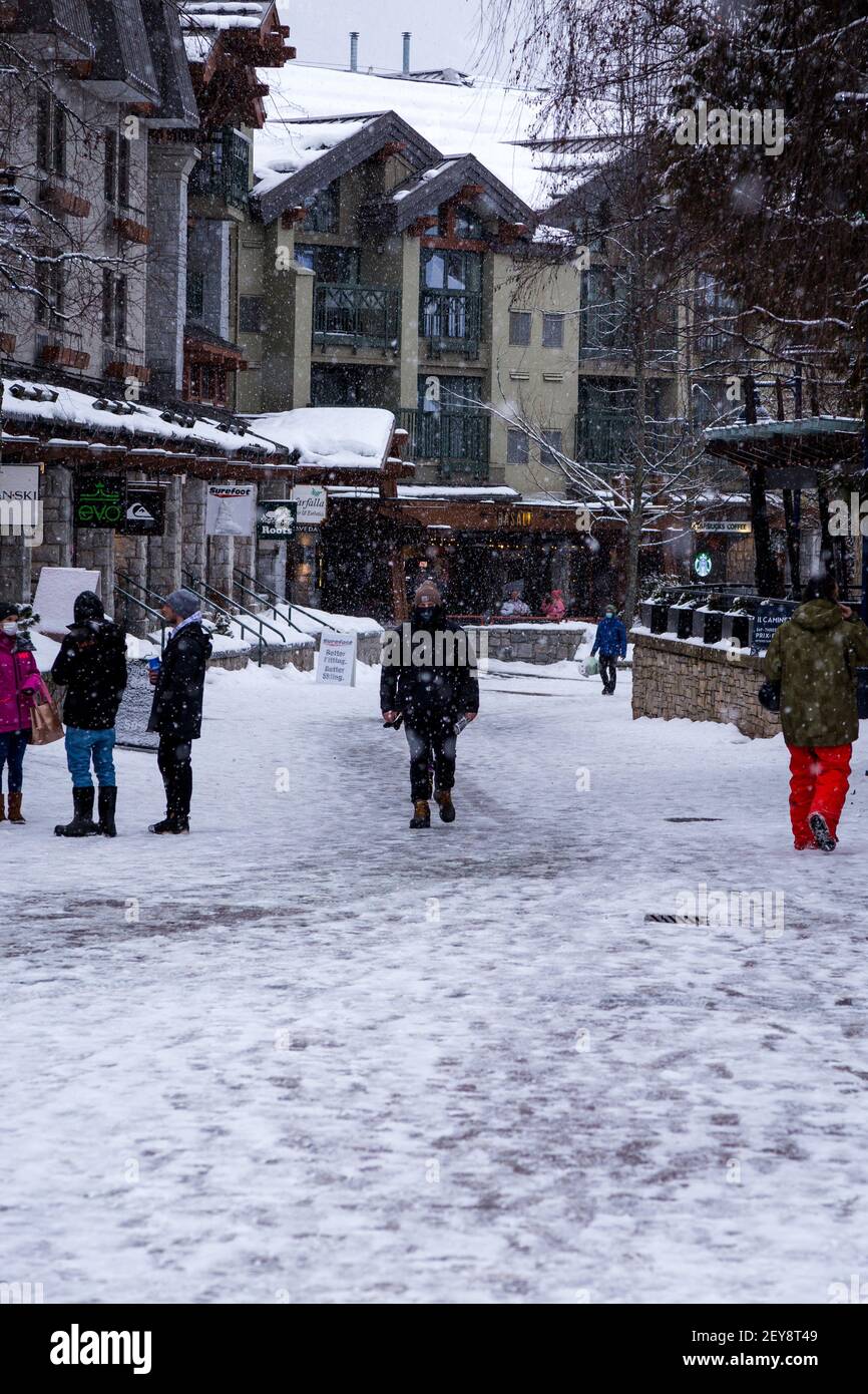 WHISTLER, BC, CANADA - FEB 28, 2021: Whistler Village with people during the Covid 19 pandemic. Stock Photo