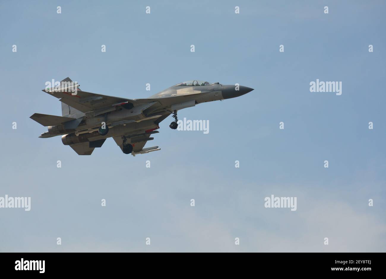 Twin engine Shenyang-J11 Chinese fighter plane coming in to land at Jiaxing air base. Missiles can be seen under wing and fuselage. Stock Photo