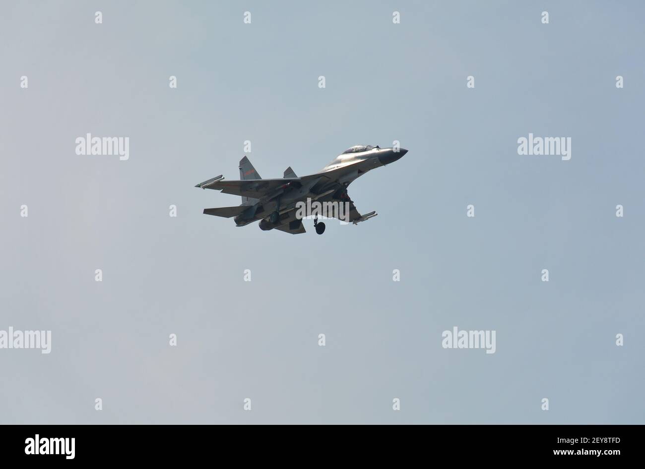 Twin engine Shenyang-J11 Chinese fighter plane coming in to land at Jiaxing air base. Missiles can be seen under wing and fuselage. Stock Photo