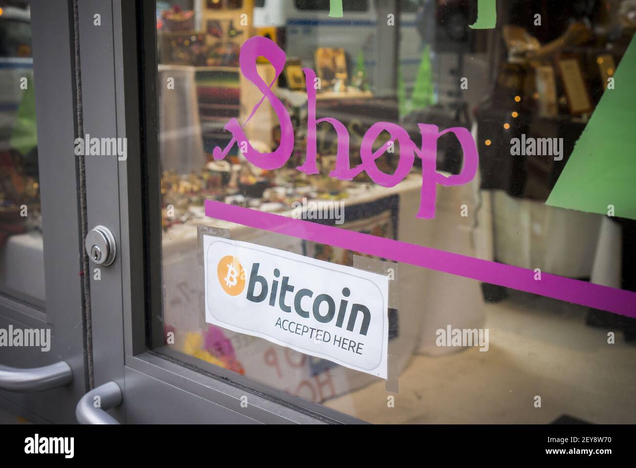 A pop-up store in Midtown Manhattan in New York displays a sign stating  that they will accept the crypto-currency bitcoin as payment, seen on  Thursday, December 19, 2013. The digital currency reached