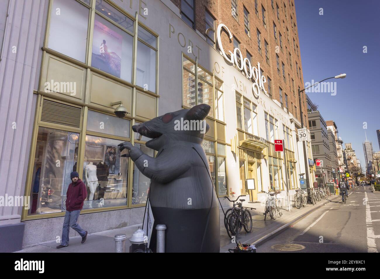Asbestos workers set up a giant rat outside 111 Eighth Avenue, owned by ...