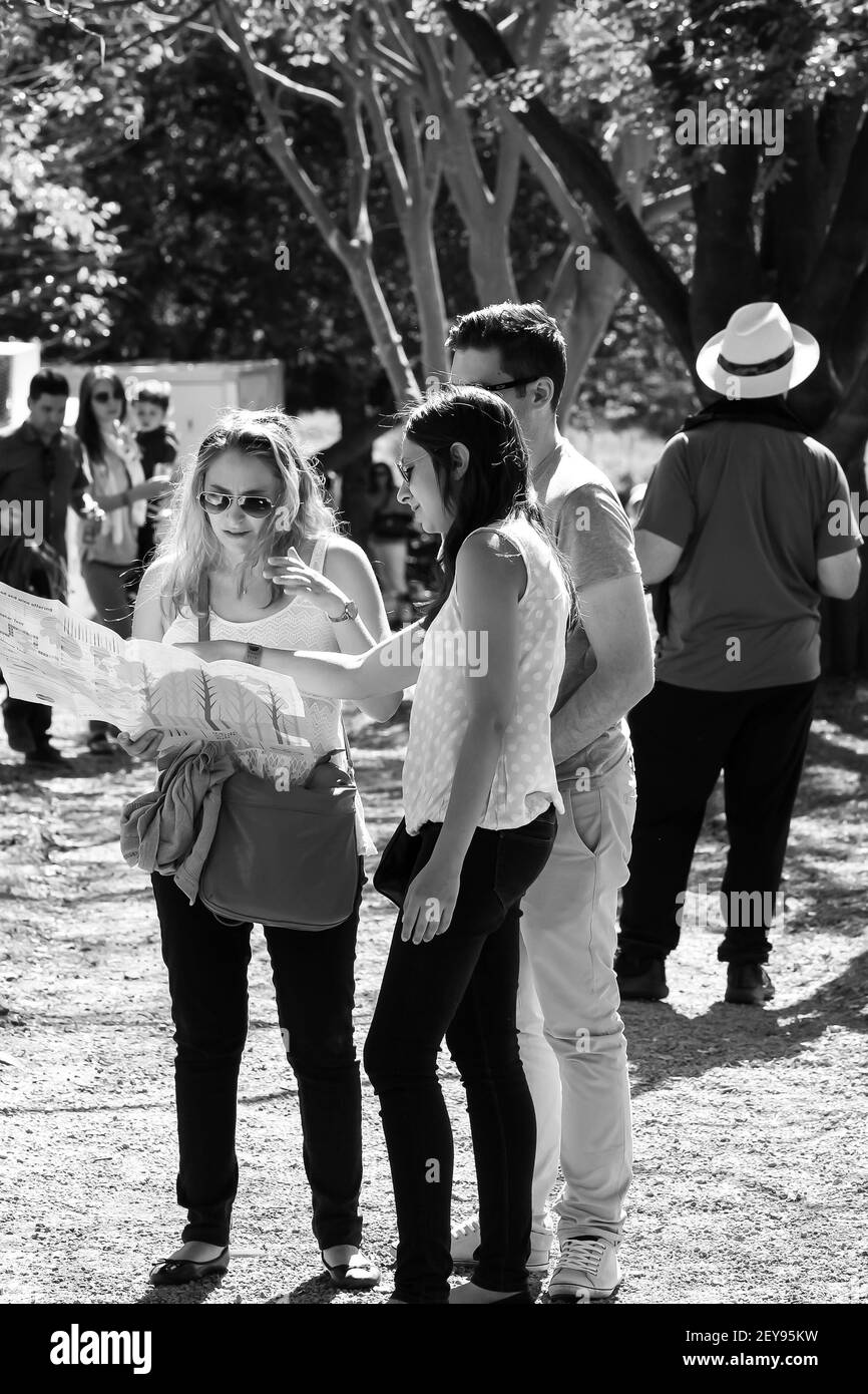 JOHANNESBURG, SOUTH AFRICA - Jan 05, 2021: Johannesburg, South Africa, 05/10/2014, Young people looking at a map at The Winter Sculpture Fair at Nirox Stock Photo