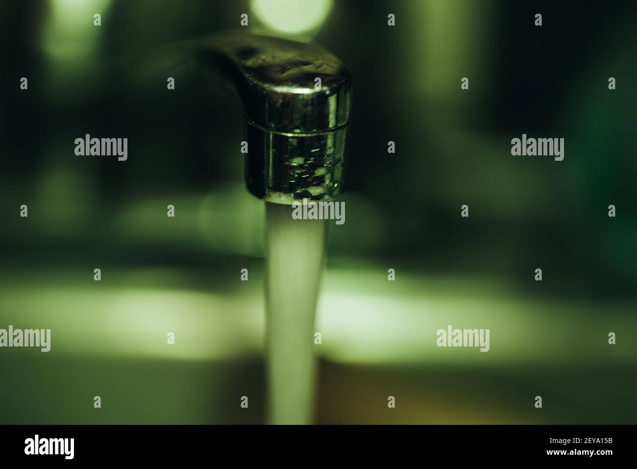 A shallow focus shot of water flowing from the tap Stock Photo - Alamy
