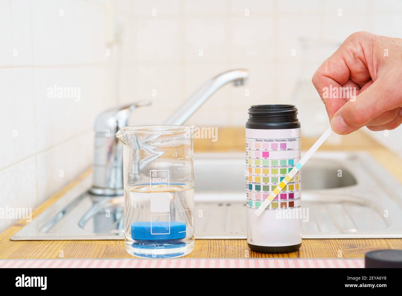 Checking tap water Stock Photo