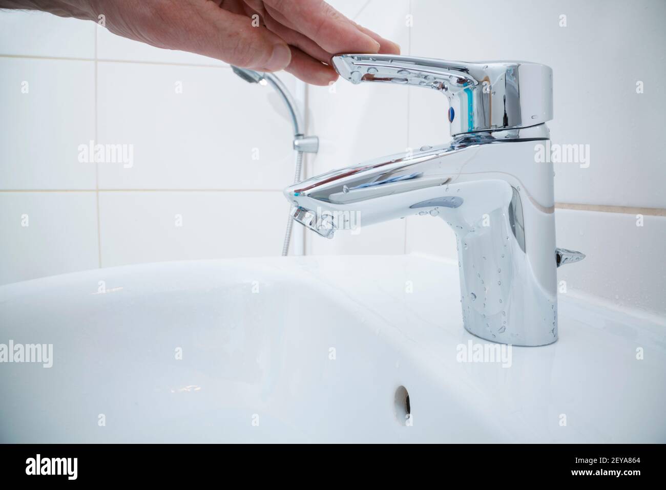 Hand closing tap hires stock photography and images Alamy