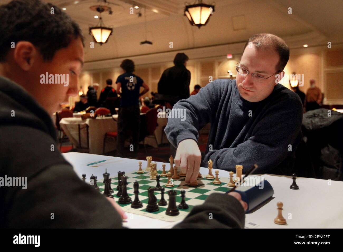 Feb 16, 2013 - St Paul, MN - Sean Nagle, right, who has been Minnesota chess champion or co-champion for the past four years (currently he's champion) defends his title, at the Minnesota Open Chess Tournament at the Crown Plaza in St. Paul, Minnesota, February 16, 2013. Here, he opened the tournament against Kyler Weatherspoon. Photo Credit: Tom Wallace/Minneapolis Star Tribune/MCT/Sipa USA Stock Photo