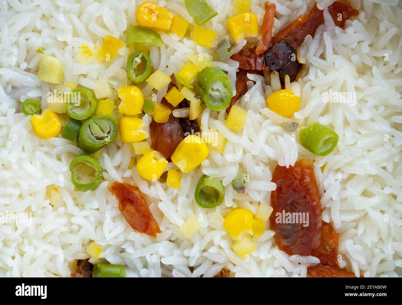 fresh cooked rice with Chinese style sausage and bacon as background