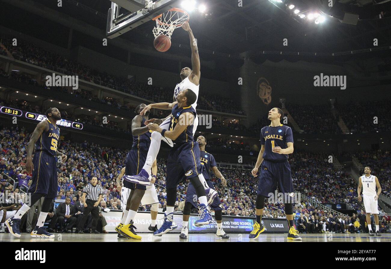 Kansas State's Jordan Henriquez dunks against La Salle's Tyreek Duren  during the second half of a second-round game in the NCAA Men's Basketball  Tournament at the Sprint Center in Kansas City, Missouri,