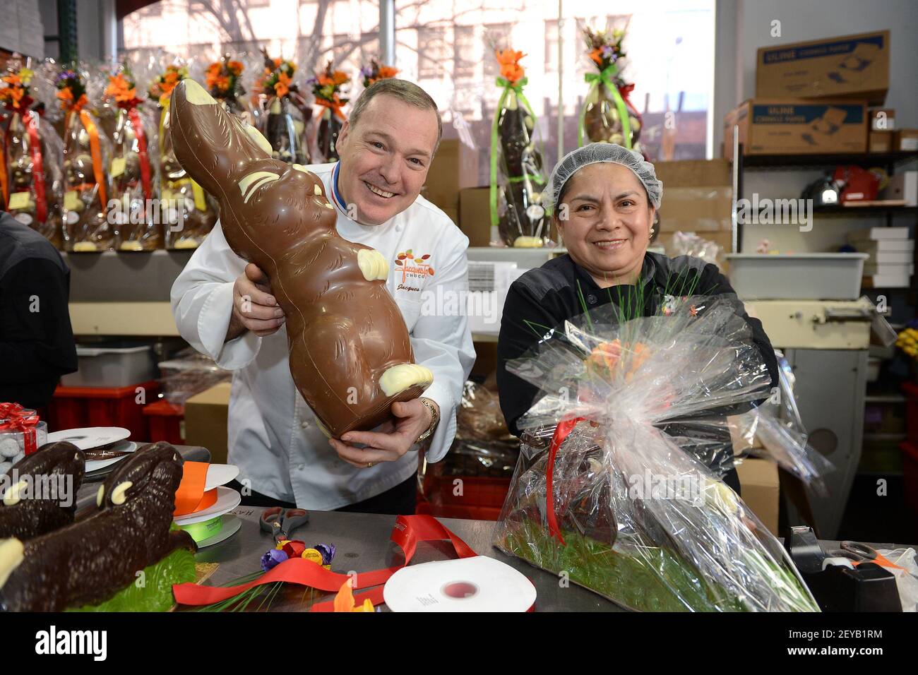 Chocolatier Jacques Torres poses next to Maria Calle, chocolatier