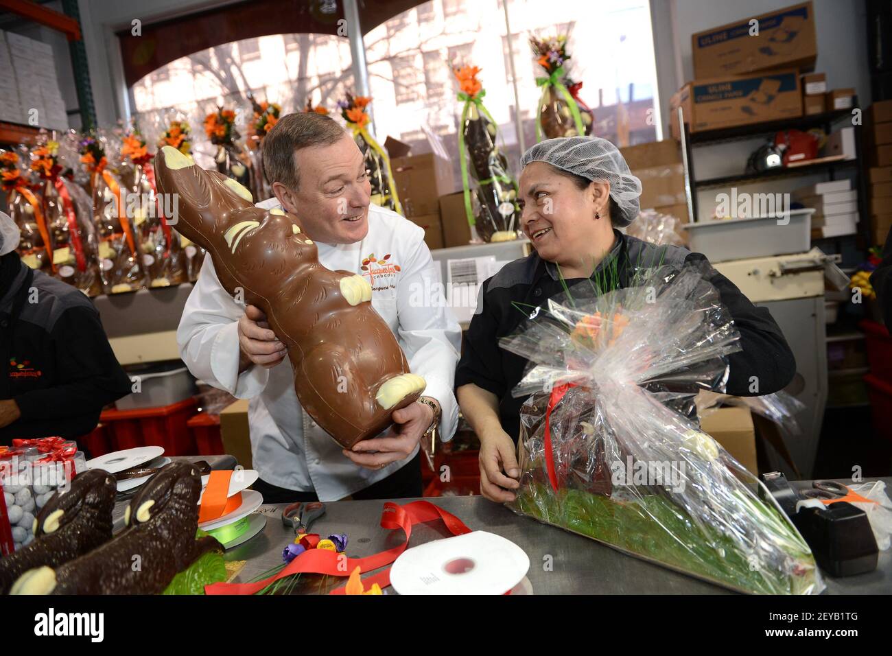 Chocolatier Jacques Torres poses next to Maria Calle, chocolatier