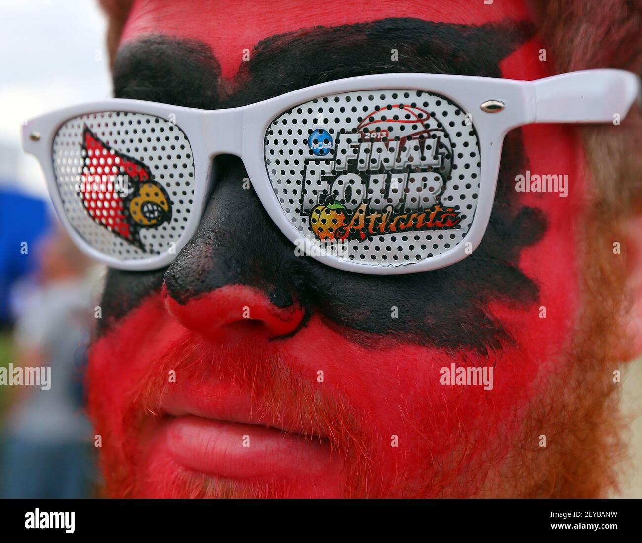 University of Louisville student Nick Pappe sports a pair of 2013 Final  Four Cardinals glasses as he arrives painted in red for the NCAA Men's  Basketball National Championship game between Louisville and