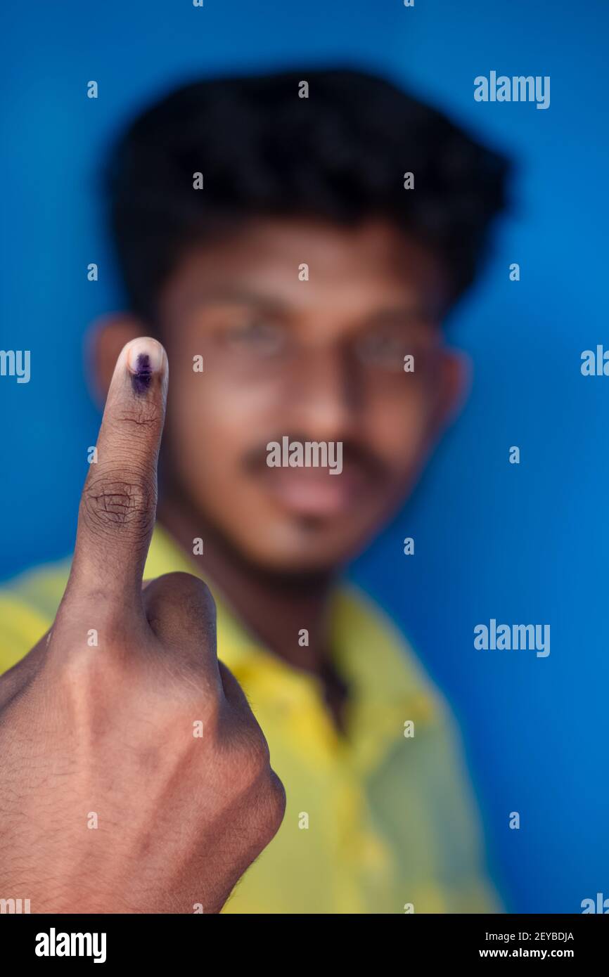 Chennai, India - 5th March 2021: Indian Voter Showing His Hand with voting sign and ink pointing vote for India. Stock Photo