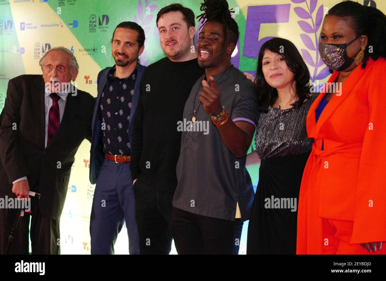 Miami, United States. 05th Mar, 2021. (L-R) Alan Myles Heyman, Mark Pulaski, Jonathan Cuartas, Edson Jean, Fabiola Rodriguez, and Kerline Alce walk the red carpet at the Miami Dade College's 38th Annual Miami Film Festival Opening Night and World Premiere of LUDI at the Silverspot Cinema in Miami, Florida, Friday, March 5, 2021. Photo by Gary I Rothstein/UPI Credit: UPI/Alamy Live News Stock Photo