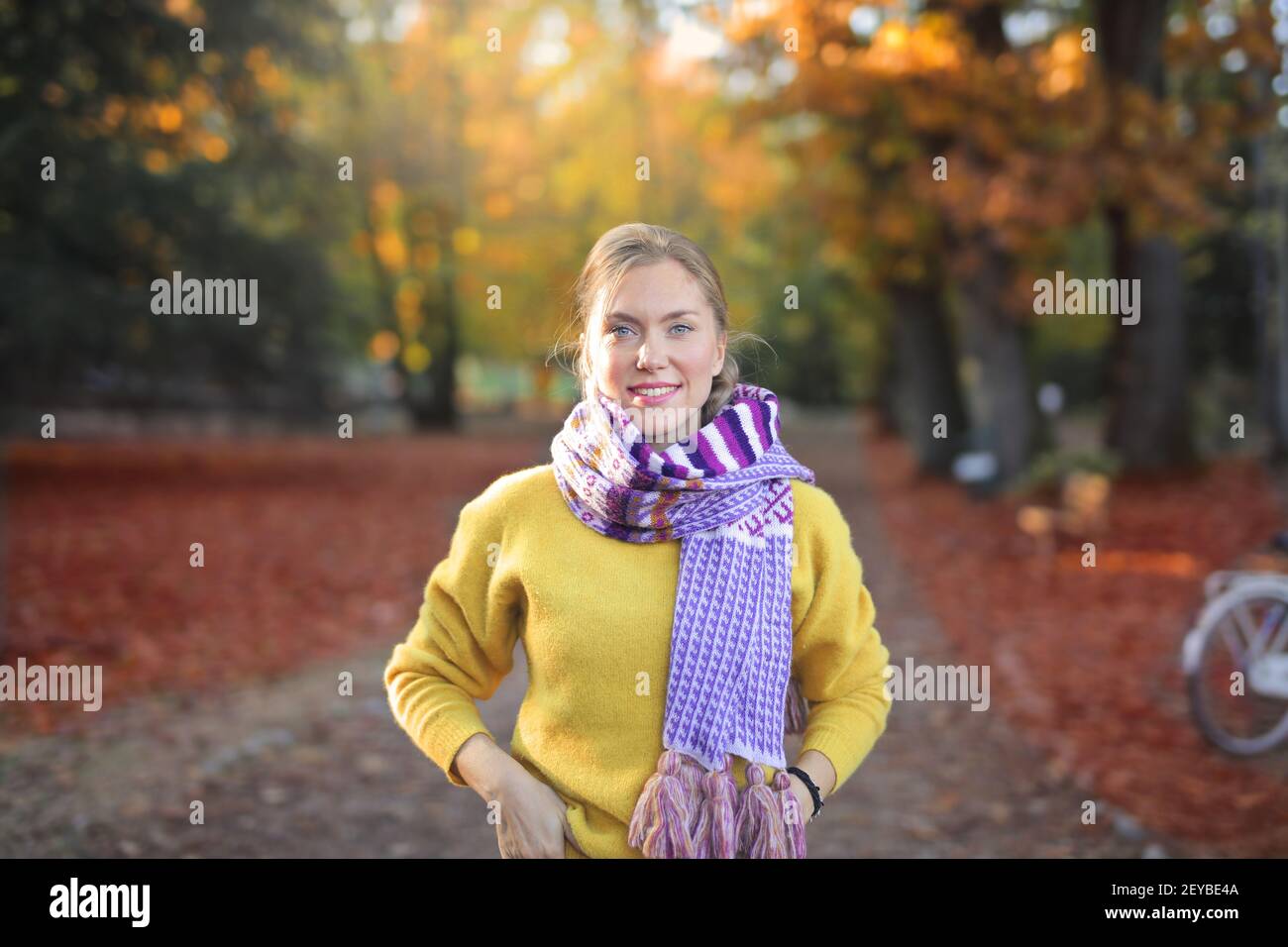 A portrait of a smiling European female in an autumn park Stock Photo ...