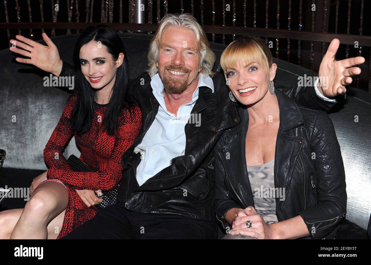 In this photo released by Virgin America Airlines, Virgin Group Founder Sir Richard Branson is joined by actress Jaime Pressly (R) and Krysten Ritter during the launch of new nonstop service from Los Angeles International (LAX) to Las Vegas McCarran International (LAS) Airport, Monday, April 22, 2013 in Las Vegas. The new three daily roundtrip flights from LAX will add to the airline's existing service from San Francisco and New York to Las Vegas McCarran. (Photo by Bob Riha, Jr./Virgin America/Sipa USA) Stock Photo