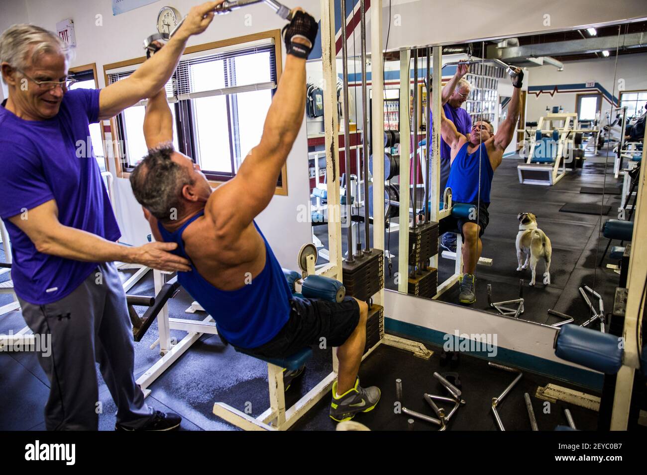 Jeff Johnson, left, owner of Flex Gym & Fitness Center in Ottawa, Illinois,  trains with member Dave Young, April 11, 2013. Johnson has been in the  bodybuilding world for three decades. (Photo
