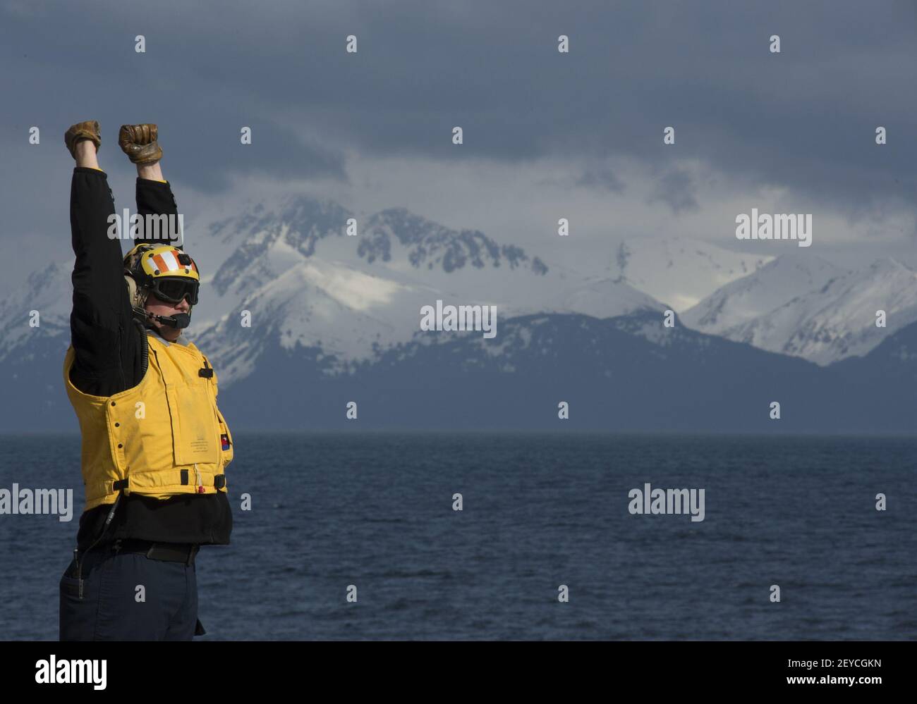 U.S. Navy Aviation Boatswain's Mate (Fuel) Richard St. Clair directs ...
