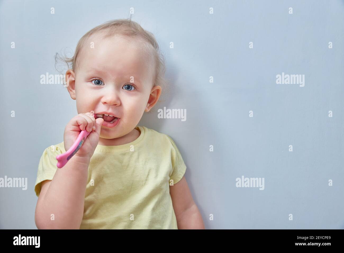 Baby girl brushing her teeth. opy space Stock Photo Alamy