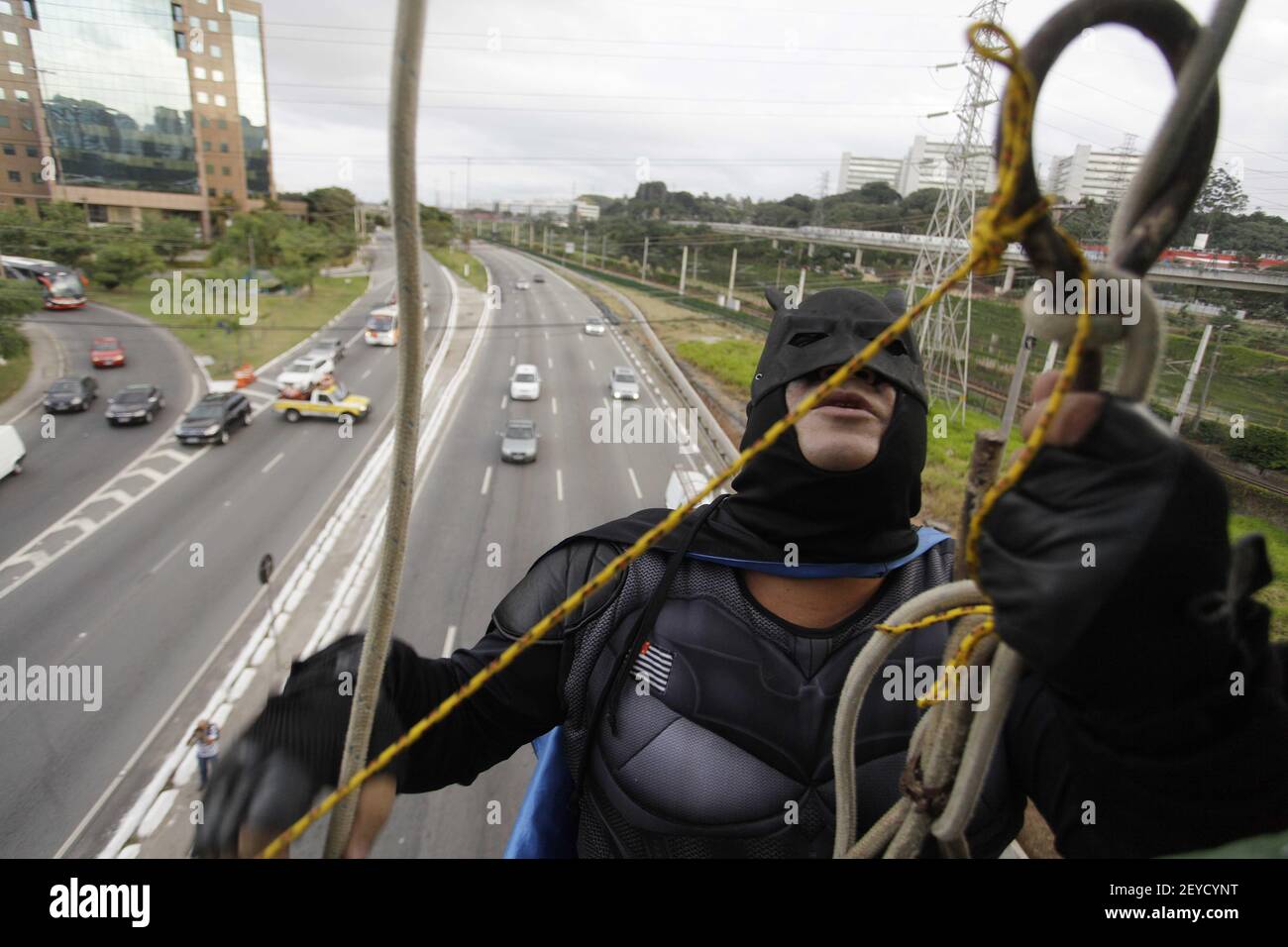 A man masked as Batman (on the photo) and another one as SpiderMan ...
