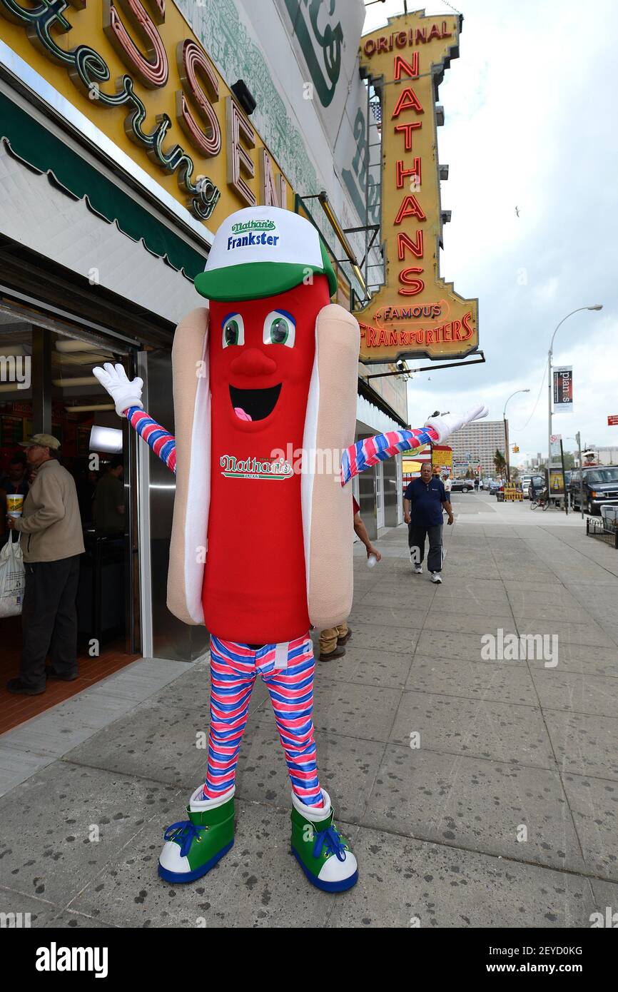 Frankster, Nathan's Famous Hot Dog Restaurant's mascot, poses outside the newly re-opened Nathan's Famous Flagship Coney Island Restaurant in the New York borough of Brooklyn, New York, on May 23, 2013. The restaurant, located on the corner of Surf and Stillwell Avenue since 1916, re-opened after closing in October of 2012 after suffering extensive damage caused by Hurricane Sandy. (Photo by Anthony Behar/Sipa USA) Stock Photo