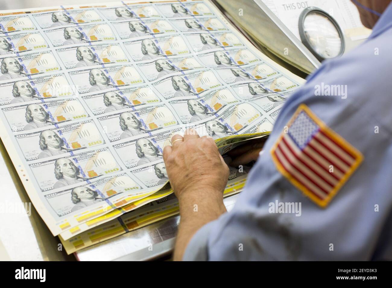 The newly redesigned $100 bill being printed at the Bureau of Engraving ...