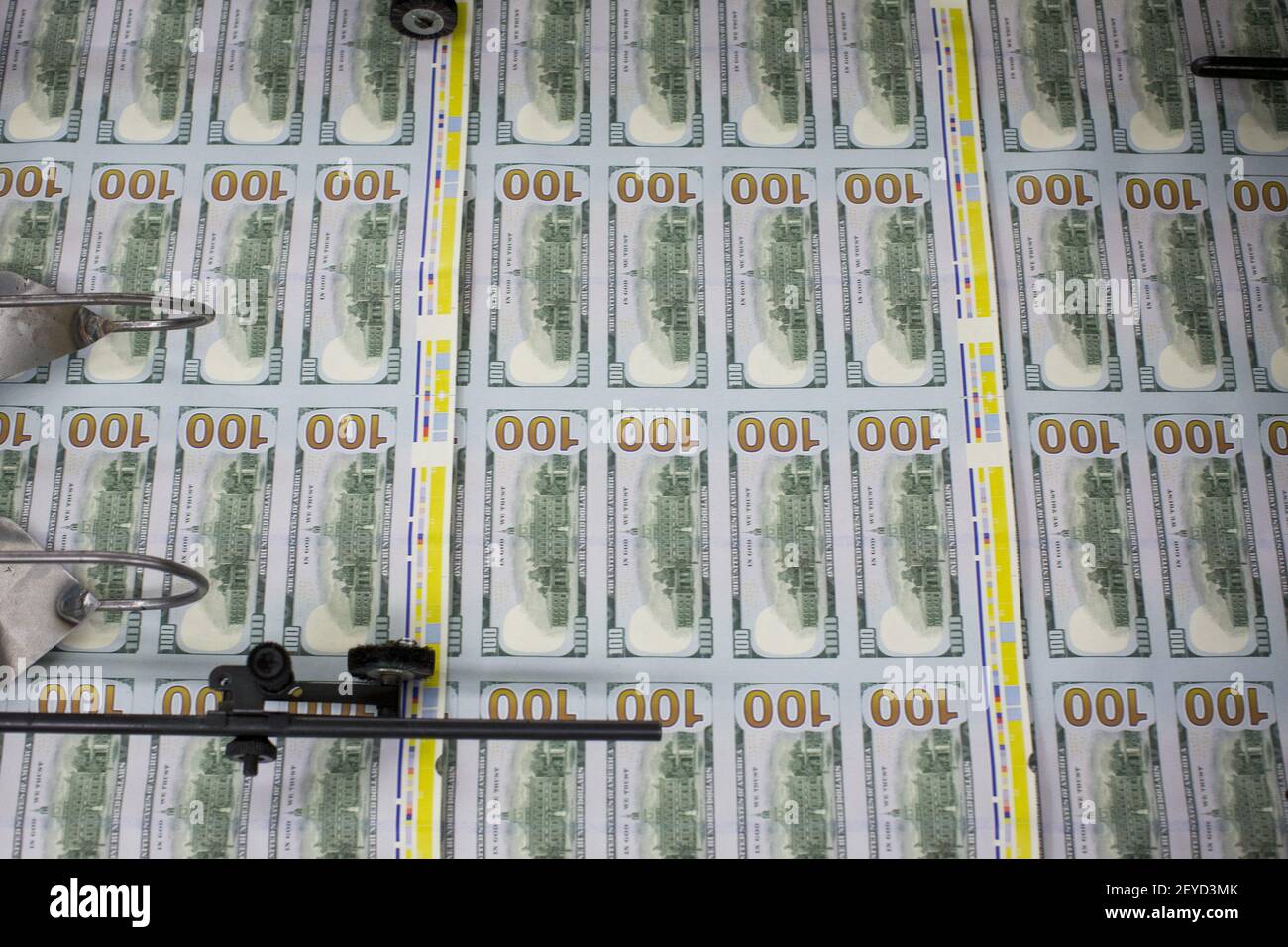 The newly redesigned $100 bill being printed at the Bureau of Engraving ...