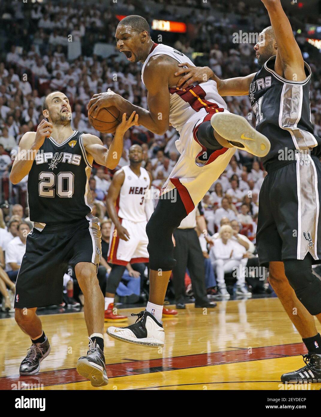 https://c8.alamy.com/comp/2EYDECP/chris-bosh-of-the-miami-herald-on-an-offensive-rebound-during-the-third-quarter-in-game-2-of-the-nba-finals-at-the-americanairlines-arena-in-miami-florida-sunday-june-9-2013-the-miami-heat-defeated-the-san-antonio-spurs-103-84-photo-by-al-diazmiami-heraldmctsipa-usa-2EYDECP.jpg