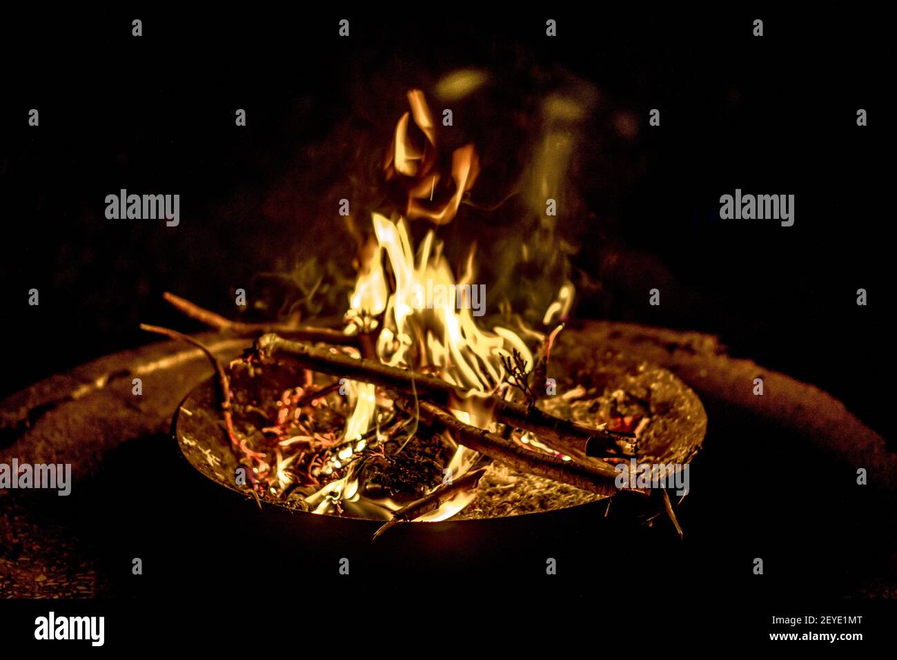 A closeup of a bonfire with beautiful flames captured at night Stock